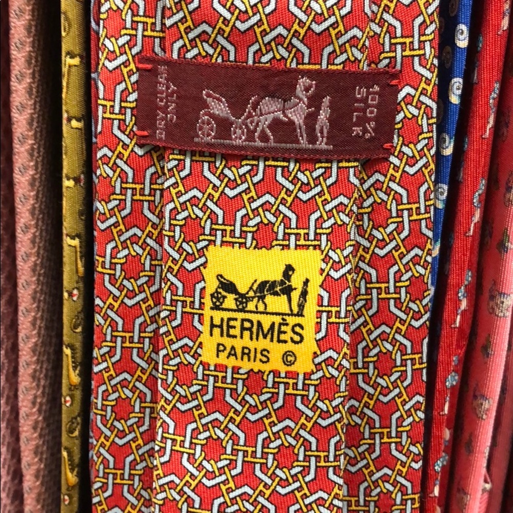 Hermès tie. Red, gold, and white.